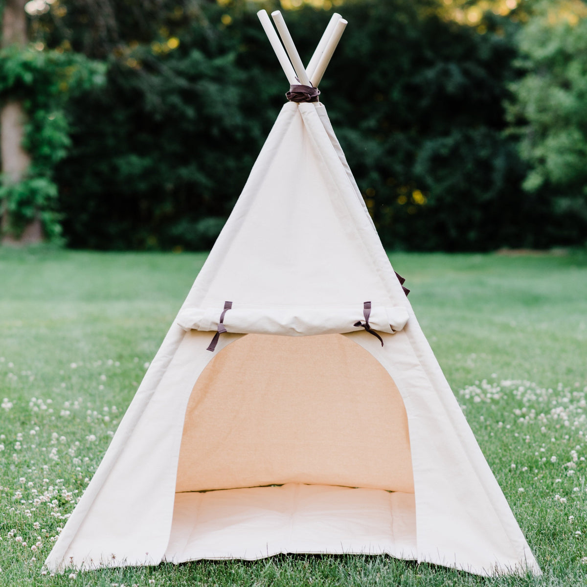 natural canvas teepee with a matching mat