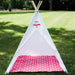 large white kids teepee with hot pink mat