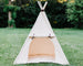 natural canvas teepee with a matching mat