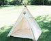 natural canvas teepee with a matching mat